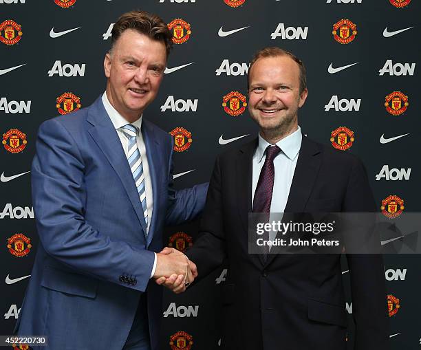 New manager Louis van Gaal of Manchester United poses with Executive Vice Chairman Ed Woodward as he starts his new role at Aon Training Complex on...