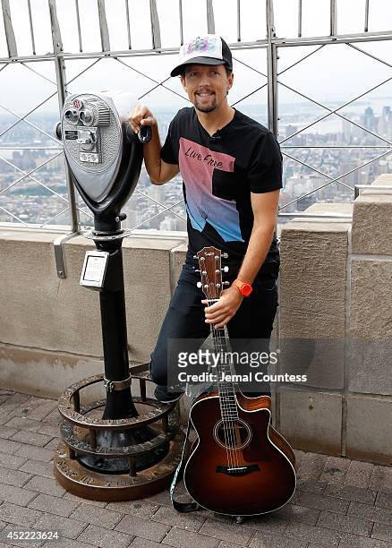 Musician Jason Mraz announces his "Five Boroughs Tour" during a visit to The Empire State Building on July 16, 2014 in New York City.