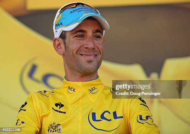 Vincenzo Nibali of Italy and the Astana Pro Team takes the podium as he defended the overall race leader's jersey during the eleventh stage of the...