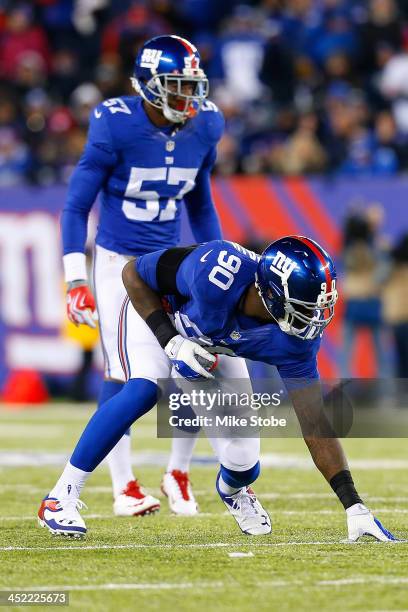 Jason Pierre-Paul and Jacquian Williams of the New York Giants in action against the Dallas Cowboys at MetLife Stadium on November 24, 2013 in East...