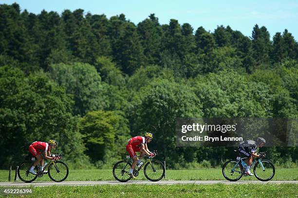 Nicolas Edet of Cofidis, Rein Taaramae of Cofidis and Michal Kwiatkowski of Omega Pharma-Quickstep in action during the eleventh stage of the 2014...