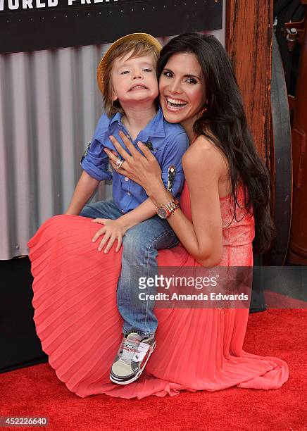 Television personality Joyce Giraud and her son Leonardo Ohoven arrive at the Los Angeles premiere of Disney's "Planes: Fire & Rescue" at the El...