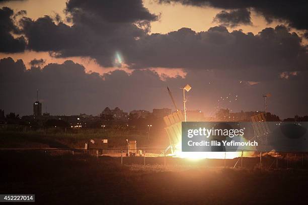 The Iron Dome air-defense system fires to intercept a rocket over the city of Ashdod on July 16, 2014 in Ashdod,Israel. An Egyptian ceasefire...