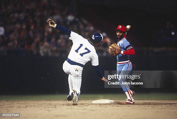 World Series: St. Louis Cardinals Ozzie Smith in action, making throw to turn double play vs Milwaukee Brewers Jim Gantner at County Stadium....