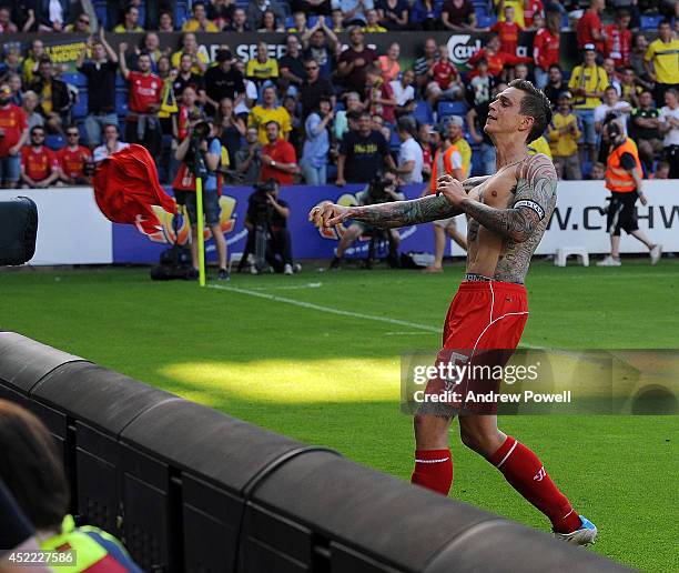 Daniel Agger of Liverpool throws his shirt to a fan during the pre-season friendly match between Brondby IF and Liverpool FC at Brondby Stadium on...