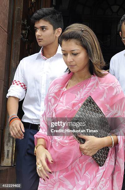 Wife of Congress MP Jyotiraditya Scindia, Priyadarshini Raje Scindia with her son Aryaman Scindia come out after visiting Parliament house on July...