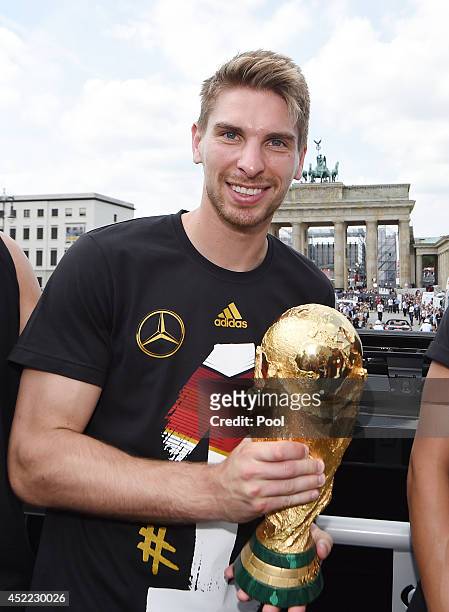 Ron-Robert Zieler celebrates during the German team victory ceremony on July 15, 2014 in Berlin, Germany. Germany won the 2014 FIFA World Cup Brazil...