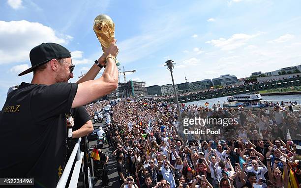 Benedikt Hoewedes celebrate during the German team victory ceremony on July 15, 2014 in Berlin, Germany. Germany won the 2014 FIFA World Cup Brazil...