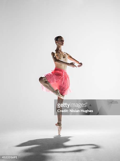 ballerina in passe with arms in first position - woman twirling stock pictures, royalty-free photos & images