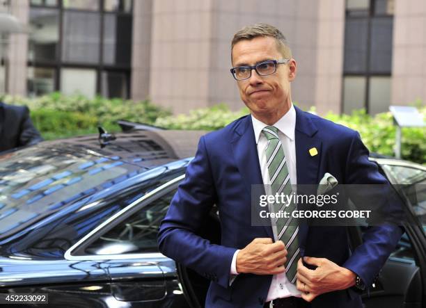 Finnish Prime Minister Alexander Stubb arrives on July 16, 2014 for a special meeting of the European Council to discuss further appointments of the...