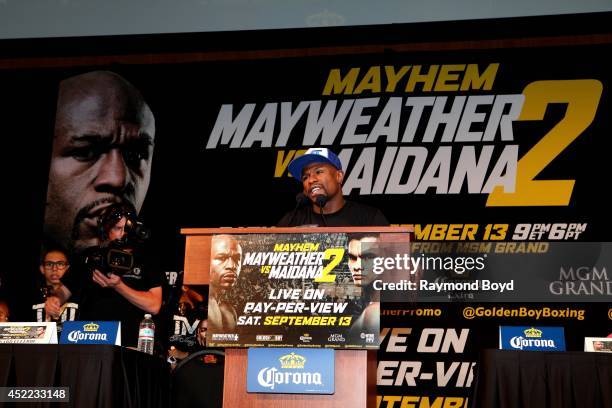 Boxer Floyd "Money" Mayweather, Jr. Acknowledges his fans during the "Mayhem: Mayweather vs. Maidana II" championship rematch press conference at the...