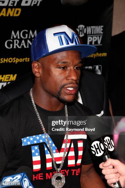 Boxer Floyd "Money" Mayweather, Jr. Is interviewed during the "Mayhem: Mayweather vs. Maidana II" championship rematch press conference at the...