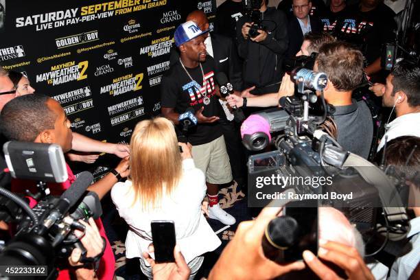 Boxer Floyd "Money" Mayweather, Jr. Is interviewed during the "Mayhem: Mayweather vs. Maidana II" championship rematch press conference at the...