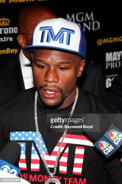 Boxer Floyd "Money" Mayweather, Jr. Is interviewed during the "Mayhem: Mayweather vs. Maidana II" championship rematch press conference at the...