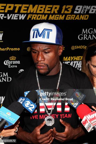 Boxer Floyd "Money" Mayweather, Jr. Is interviewed during the "Mayhem: Mayweather vs. Maidana II" championship rematch press conference at the...