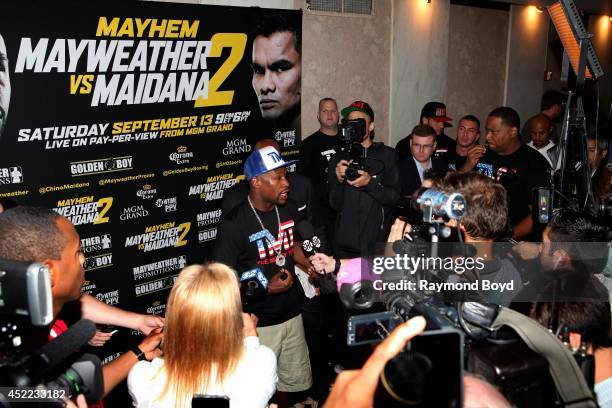 Boxer Floyd "Money" Mayweather, Jr. Is interviewed during the "Mayhem: Mayweather vs. Maidana II" championship rematch press conference at the...