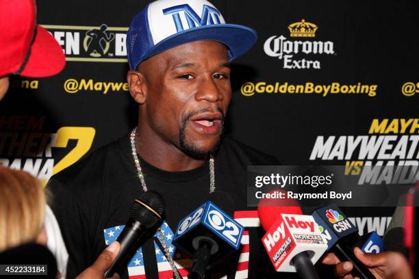 Boxer Floyd "Money" Mayweather, Jr. Is interviewed during the "Mayhem: Mayweather vs. Maidana II" championship rematch press conference at the...