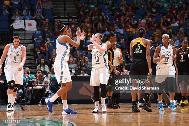 Lindsay Whalen of the Minnesota Lynx celebrates with her teammate against the Tulsa Shock during the WNBA game on July 16, 2014 at Target Center in...