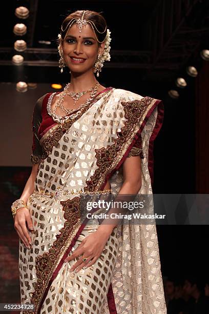 Amruta Patki walks the runway at the Swarovski show during day 2 of the India International Jewellery Week 2014 at grand Hyatt on July 15, 2014 in...