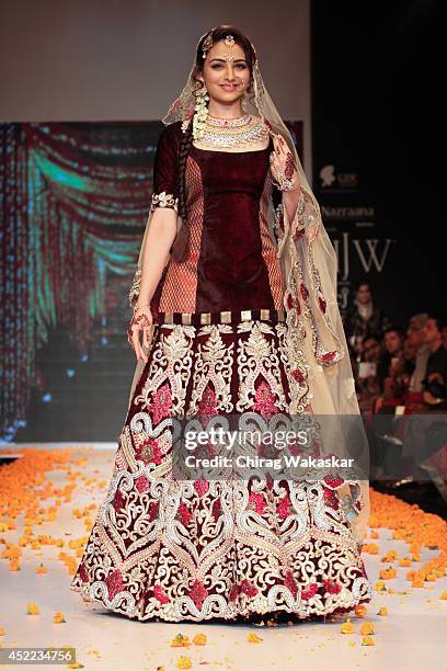 Zoya Afroz walks the runway at the Swarovski show during day 2 of the India International Jewellery Week 2014 at grand Hyatt on July 15, 2014 in...