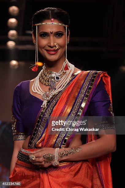 Prachi Mishra walks the runway at the Swarovski show during day 2 of the India International Jewellery Week 2014 at grand Hyatt on July 15, 2014 in...