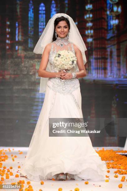 Manasi Moghe walks the runway at the Swarovski show during day 2 of the India International Jewellery Week 2014 at grand Hyatt on July 15, 2014 in...