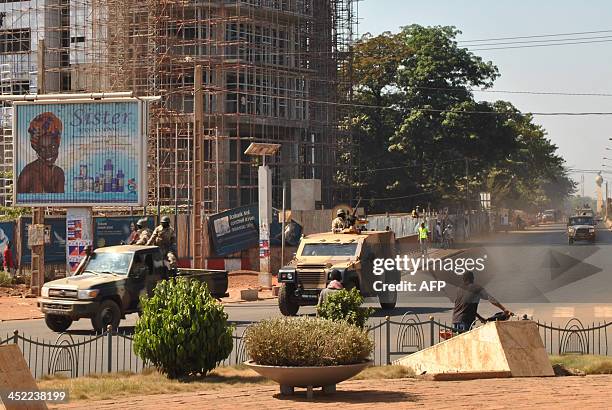 Convoy transporting Malian ex-coup leader Amadou Sanogo drives to the gendarmerie in Bamako on November 27, 2013. Sanogo, who led a March 2012 coup...