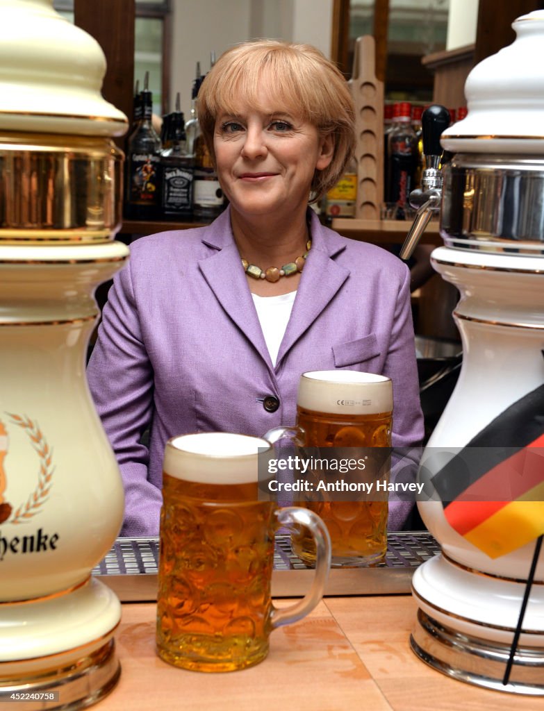 Madame Tussauds Take Their Angela Merkel Wax Figure To Celebrate Her 60th Birthday And The German World Cup Win