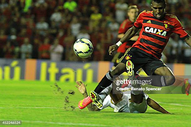 Eriko Jr of Sport Recife battles for the ball with Junior Cesar of Botafogo during the Brasileirao Series A 2014 match between Sport Recife and...