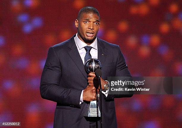 Player Michael Sam accepts the Arthur Ashe Courage Award onstage during the 2014 ESPYS at Nokia Theatre L.A. Live on July 16, 2014 in Los Angeles,...
