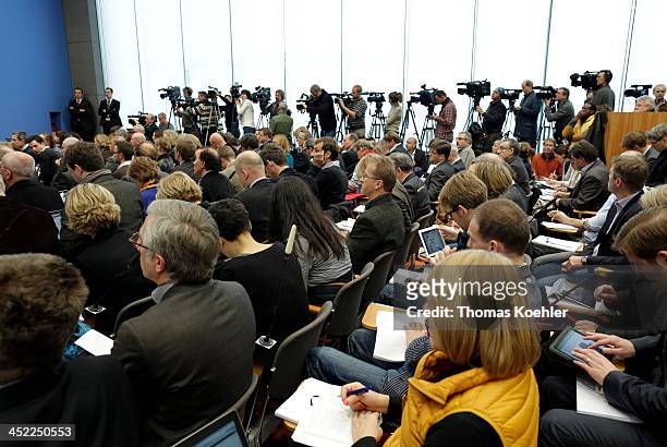 Journalists listen to for German Chancellor and Chairwoman of the German Christian Democrats Angela Merkel, Chairman of the Bavarian Christian...