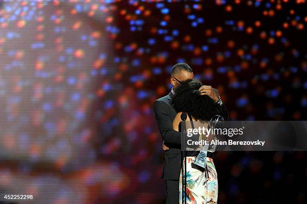 Sportscaster Stuart Scott accepts the Jimmy V Perseverance Award with his daughter onstage at the 2014 ESPY Awards at Nokia Theatre L.A. Live on July...