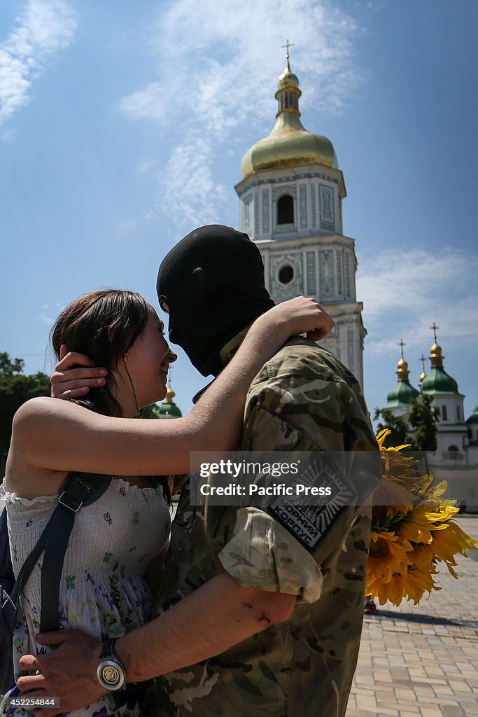 A Soldier hugs his girlfriend on the eve of their departure...