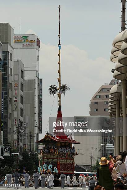 Japanese men dressed in traditional costumes tow a festival cart during the annual Kyoto Gion Festival on July 17, 2014 in Kyoto, Japan. The Gion...