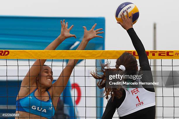 Vivian Baella of Peru competes against Natalie Giron of Guatemala in a beach volleyball match between Peru and Guatemala as part of the XVII...