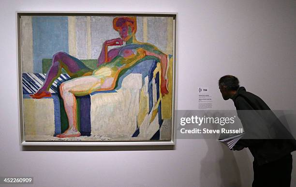 At the preview viewing a man looks at Frantisek Kupka's "Planes by Colours, Large Nude". The AGO hosts "The Great Upheaval" a collection of art from...