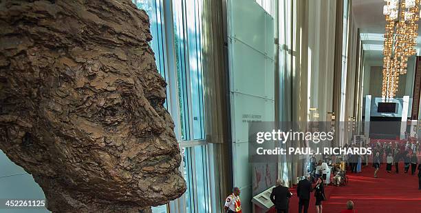 Memorial bust of former US President John F. Kennedy is seen as patrons attending the Washington National Opera walk in the lobby September 24, 2013...