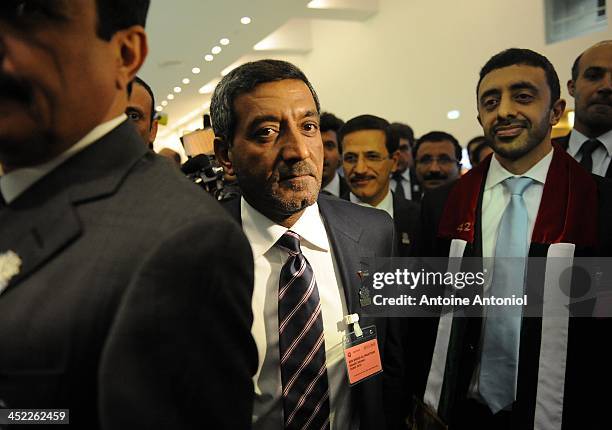 Foreign Minister Abdullah bin Zayed al-Nahyan , and Sheikh Ahmed Bin Saeed al-Maktoum , chairman of the Dubai Economic Sector Committee, react after...