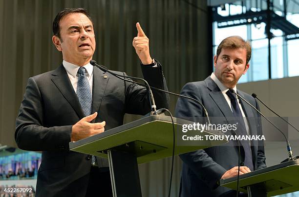 Ferran Soriano , CEO of City Football Group, which owns Manchester City Football Club, listens to Carlos Ghosn , CEO and president of Nissan Motor,...