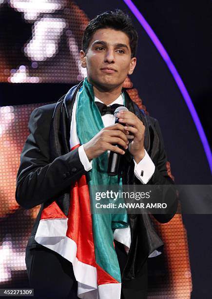 Picture taken on June 23, 2013 shows Palestinian singer Mohammed Assaf performing after he won the "Arab Idol" singing contest in Zouk Mosbeh, north...