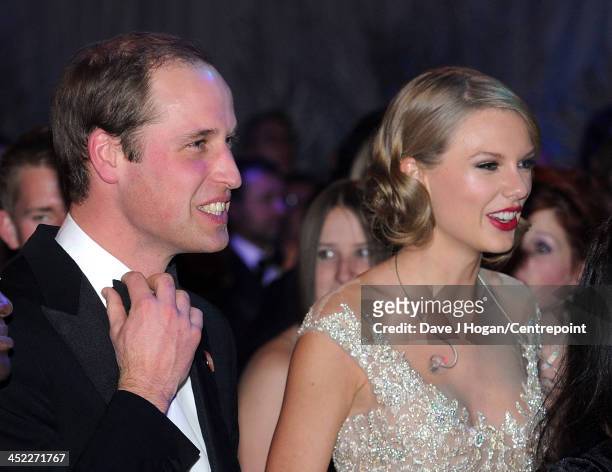 Prince William, Duke of Cambridge and Taylor Swift attend the Winter Whites Gala In Aid Of Centrepoint on November 26, 2013 in London, England.