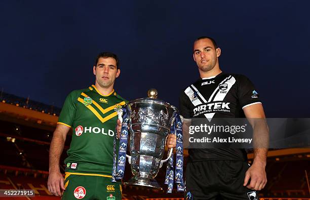 Cameron Smith the captain of Australia and Simon Mannering the captain of New Zealand hold the Rugby League World Cup during the Rugby League World...