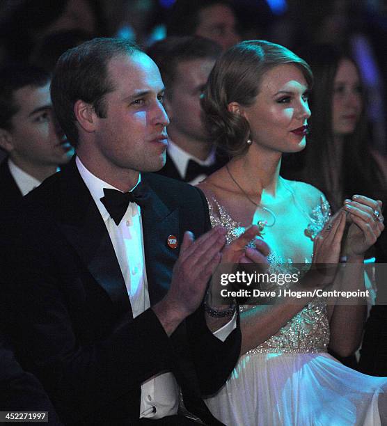 Prince William, Duke of Cambridge and Taylor Swift attend the Winter Whites Gala In Aid Of Centrepoint on November 26, 2013 in London, England.