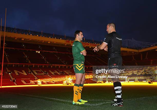 Cameron Smith the captain of Australia and Simon Mannering the captain of New Zealand talk on the Old Trafford pitch prior to the Rugby League World...