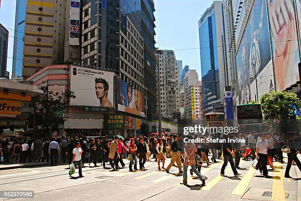 The busy pedestrian crossing on Hennessy Road, near the Sogo department store.