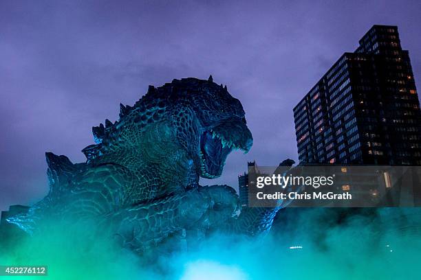 Meter replica Godzilla is lit up during a press preview at Tokyo Midtown on July 17, 2014 in Tokyo, Japan. The 'MIDTOWN Meets GODZILLA' project is in...