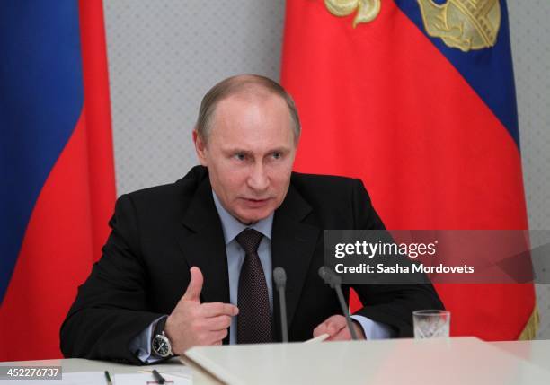 Russian President Vladimir Putin speaks at a meeting with arms corporations heads in Sochi, Russia, November 27, 2013. 22 land-based intercontinental...