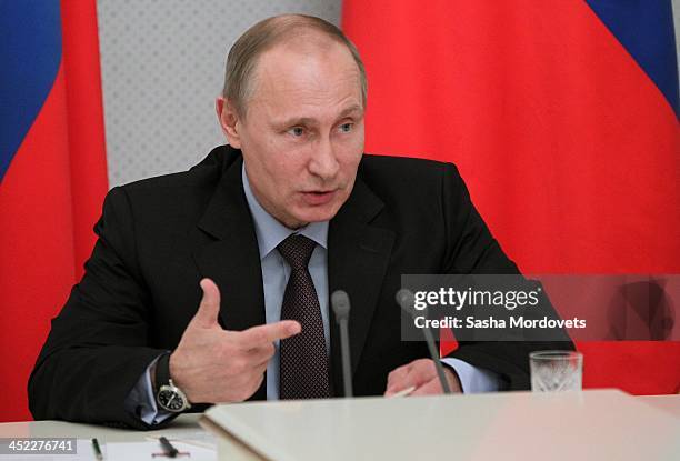 Russian President Vladimir Putin speaks at a meeting with arms corporations heads in Sochi, Russia, November 27, 2013. 22 land-based intercontinental...