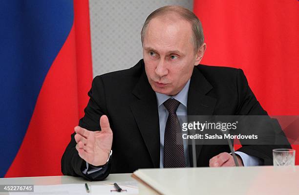 Russian President Vladimir Putin speaks at a meeting with arms corporations heads in Sochi, Russia, November 27, 2013. 22 land-based intercontinental...