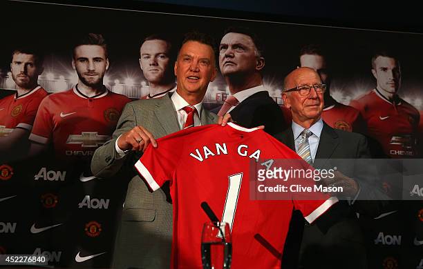 Louis van Gaal appears at a press conference with Sir Bobby Charlton as he is unveiled as the new Manchester United manager at Old Trafford on July...